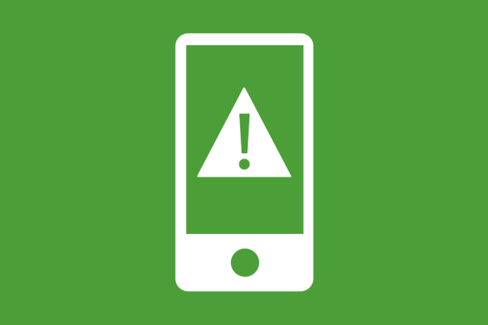 Grön bakgrund vita illustrationer, en smartphone med en varningstriangel på skärmen. 